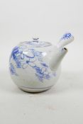 An Oriental blue and white Kyusu style teapot with floral decoration, A/F, 5" diameter