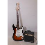 An Aria STG series electric guitar and practice amp, 39" long