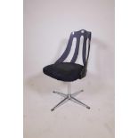 A retro black lucite and chrome desk chair