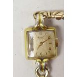 A lady's vintage Piaget wristwatch with square dial and gilt numerals and batons in gold plated case