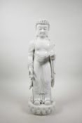 A Chinese blanc de chine figure of Buddha holding a peach, impressed marks verso, 17" high