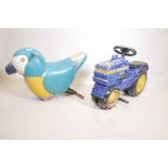 A painted metal John Deere tractor child's fairground carousel ride, and another in the form of a
