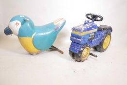A painted metal John Deere tractor child's fairground carousel ride, and another in the form of a