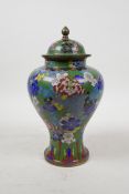 A Chinese cloisonne baluster jar and cover with all over floral decoration, 9" high