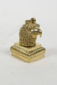 A brass document seal in the form of an eagle's head, 2"