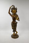 A large wooden bronze of Shiva with inset beads to her crown and bangles, 25" high