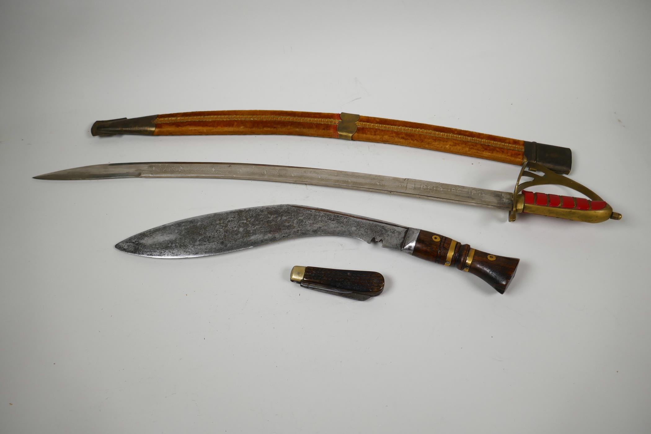 An Oriental Indian sword in velvet covered scabbard, 27½" long together with a wood and brass - Image 2 of 5