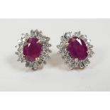 A pair of yellow gold, ruby and diamond cluster earrings, approximately 2.4cts