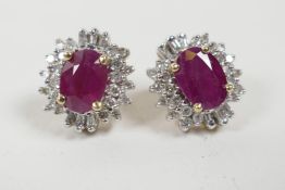 A pair of yellow gold, ruby and diamond cluster earrings, approximately 2.4cts