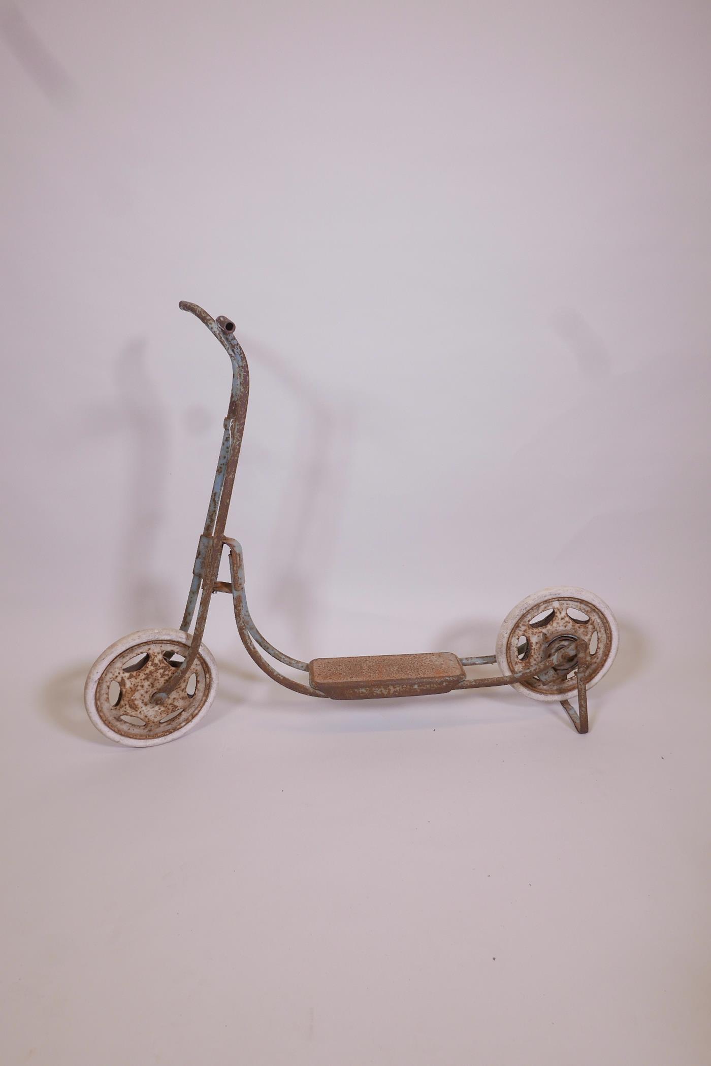 A retro Triang 1960s scooter in blue, 30½" high