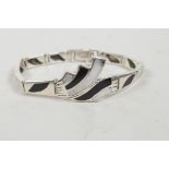 A 925 silver Art Deco style bracelet set with mother of pearl and black enamel, 7" long