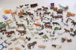 A large collection of Britains painted metal farm animals etc, and later plastic models