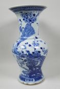 A C19th Chinese blue and white porcelain vase decorated with peacocks and prunus blossom, 14"