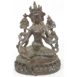 A Tibetan bronze figure of Guan Yin seated in meditation, 7" high