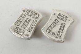 A pair of Chinese white metal trade tokens/ingots, 2" long