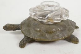 A bronze and glass inkwell cast in the form of a tortoise, 4½" long