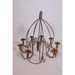A wrought iron nine branch chandelier, 26½" drop