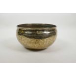 A Tibetan hammered brass singing bowl, 8½" diameter