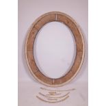 A large C19th oval sectional mirror frame, A/F, internally 28" x 38", externally 49½" x 39½"