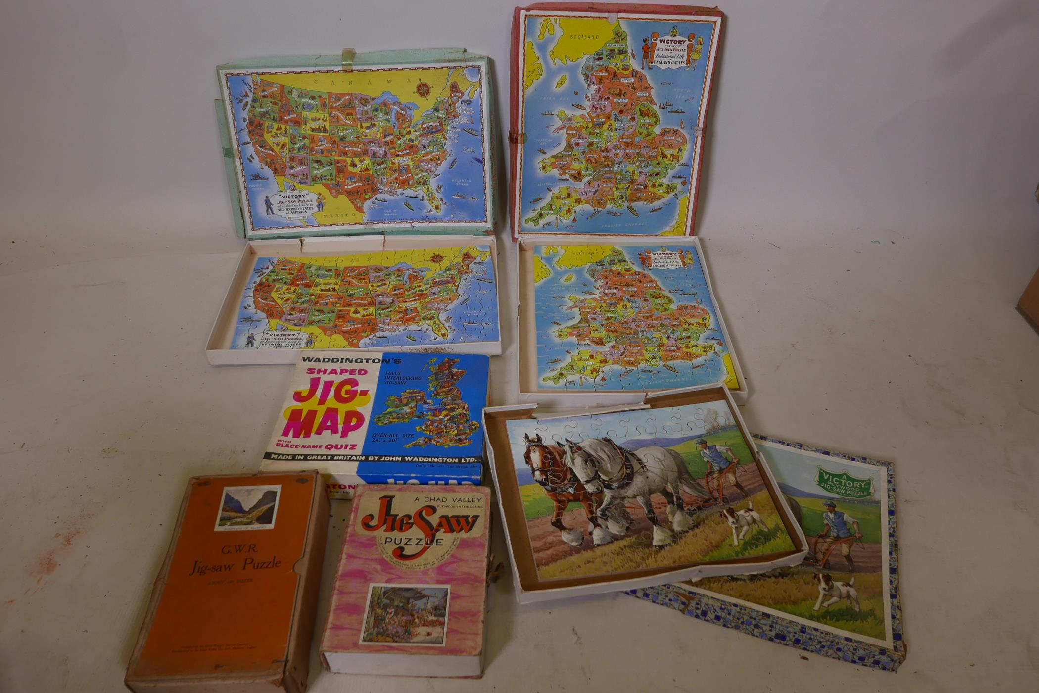 A quantity of wood jigsaw puzzles
