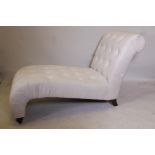 A contemporary button back linen chaise longue, 52" x 28"