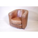 A brown leather club chair, 31" high