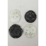 Four Chinese carved hardstone pendants decorated with auspicious animals and symbols, 2" diameter