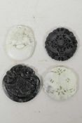 Four Chinese carved hardstone pendants decorated with auspicious animals and symbols, 2" diameter
