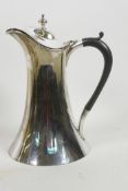 An Arts and Crafts design silver plated hot water jug with ebony handle made, by James Deakin &