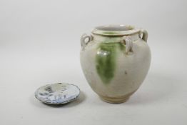 A Chinese pottery vase with four lugs and green drip glaze, together with a small early blue and