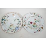 Two C18th Chinese porcelain plates, one painted with flowers, the other with a boy on a buffalo,