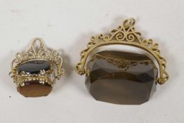 A 9ct gold smokey quartz swivel fob together with an unmarked gold swivel fob set with tiger's