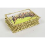 A gold plated pill box with a pictorial enamel plaque to the cover depicting the Grand National,