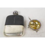 A glass, leather and hallmarked silver hip flask (silver base 89 grams), together with a