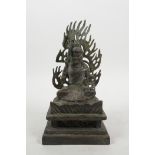 A Tibetan bronze of a sword wielding wrathful deity, 8" high