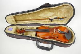 An 1/8th size student violin by Bankeri, 17" long, comes with bow in fitted hard case