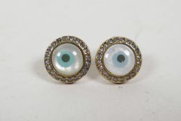 A pair of 925 silver and gilt metal all seeing eye ear studs, set with cubic zirconia