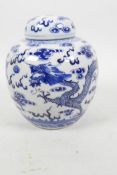 A Chinese blue and white ginger jar and cover decorated with dragons chasing the flaming pearl, 4