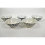 Five Chinese Tek Sing blue and white porcelain bowls, three with Nagel Auctions label to base, 5½"