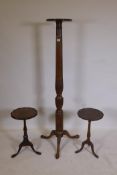 A Victorian mahogany torchere, with carved decoration and reeded column, raised on cabriole supports
