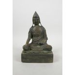 A Tibetan bronze of Buddha seated in meditation, 9" high