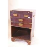 A military style bedside chest with brass mounts, a slide and two short drawers over two long, 18" x