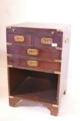 A military style bedside chest with brass mounts, a slide and two short drawers over two long, 18" x