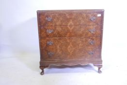 A 1920s Queen Anne style figured walnut chest of four long drawers, en suite to previous lot, 30"