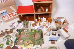 A Galt wood doll's house, in original boxes, a good quantity of doll's house furniture, kitchen