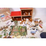 A Galt wood doll's house, in original boxes, a good quantity of doll's house furniture, kitchen