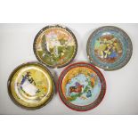 Four Indo-Persian painted terracotta plates depicting men drinking, a family in a garden, and