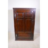 An C18th oak cupboard, with fielded panel door, 33" x 19" x 55"