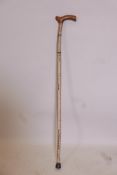 A 19C shark vertebrae walking stick, 34"