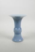 A Chinese light blue glazed porcelain Gu vase, seal mark to base, 7" high
